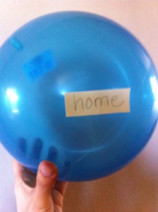 Blue balloon with the word home taped to it, Jet lag and KIDS, www.theeducationaltourist.com